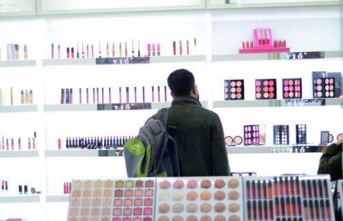 businessman choosing cosmetics in yiwu market